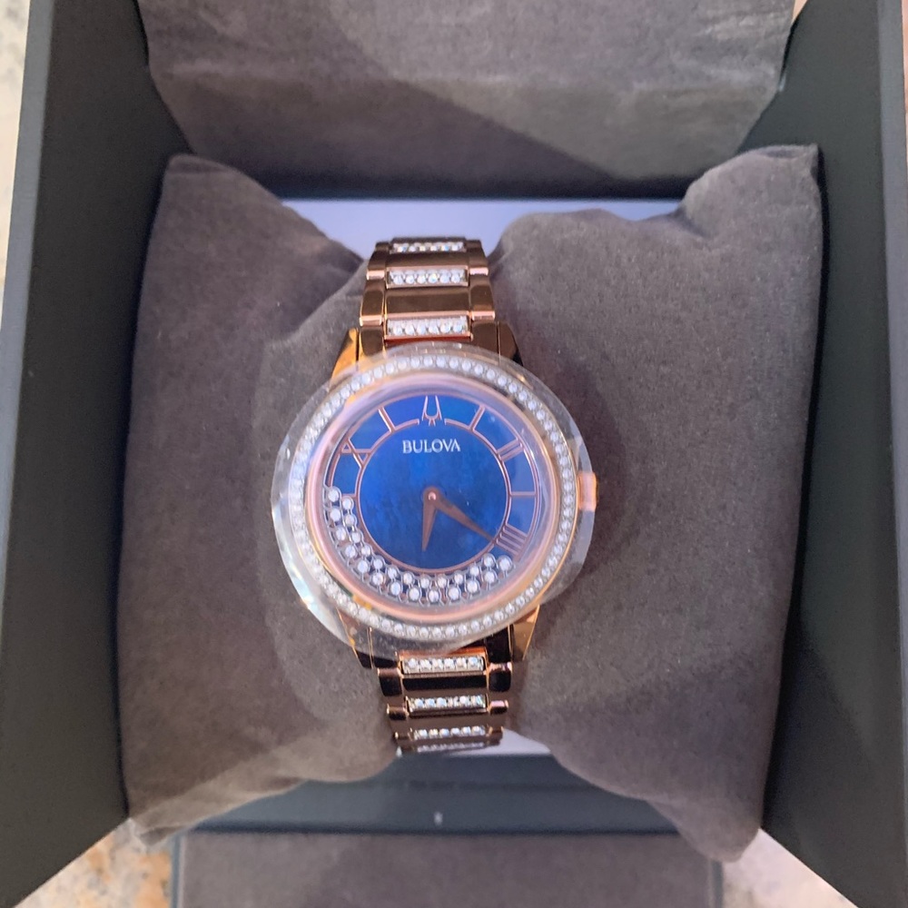 Bulova gold watch with pendulum quartz diamonds